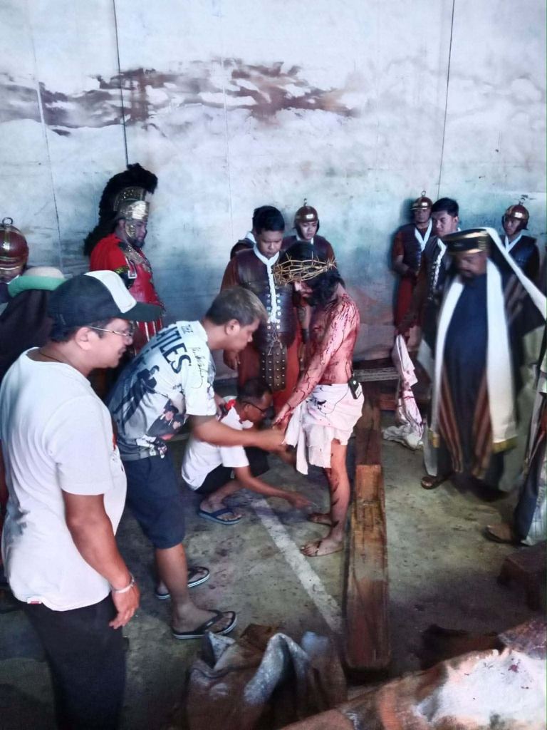 The costume department working on the prosthetics before the crucifixion scene.