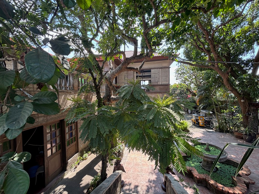 Casa de Segunda is made cooler with trees around it.