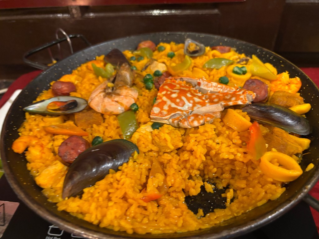 Paella - a staple dish in Filipino celebrations.